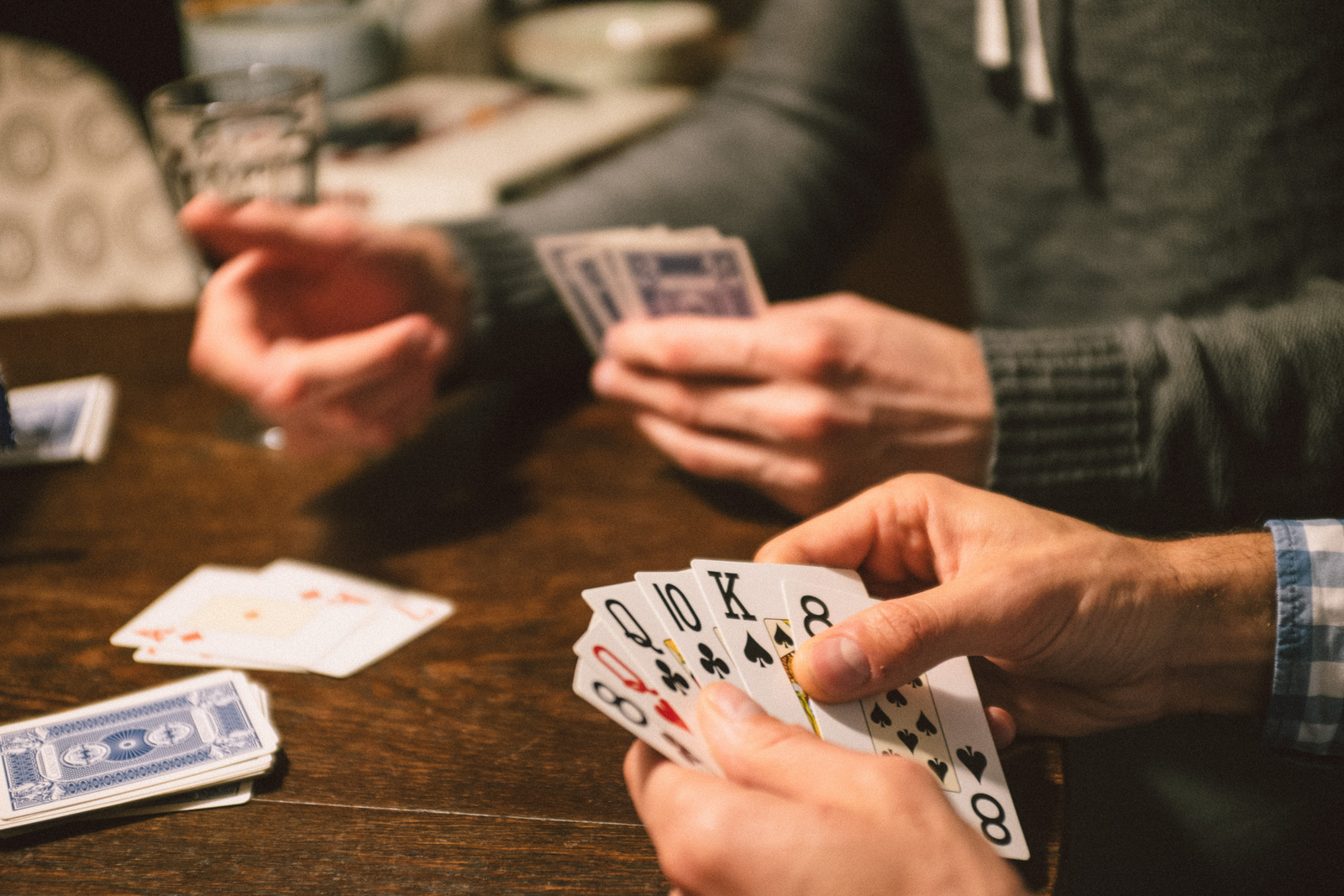 Persons Playing Card Game