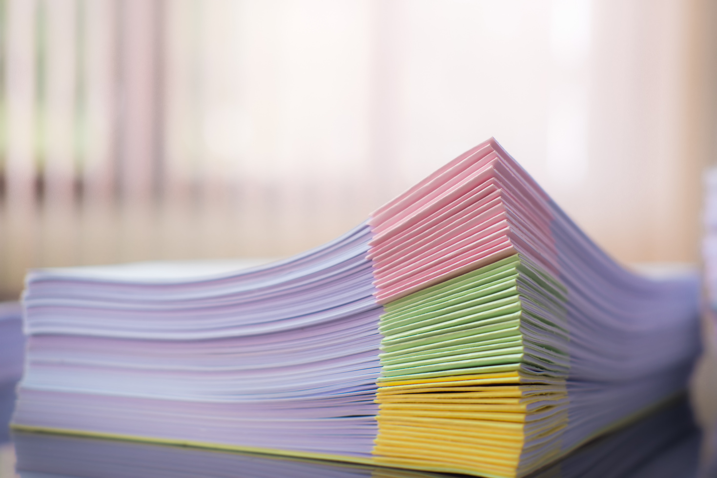 Close Up of Paper Stack on the Desk 